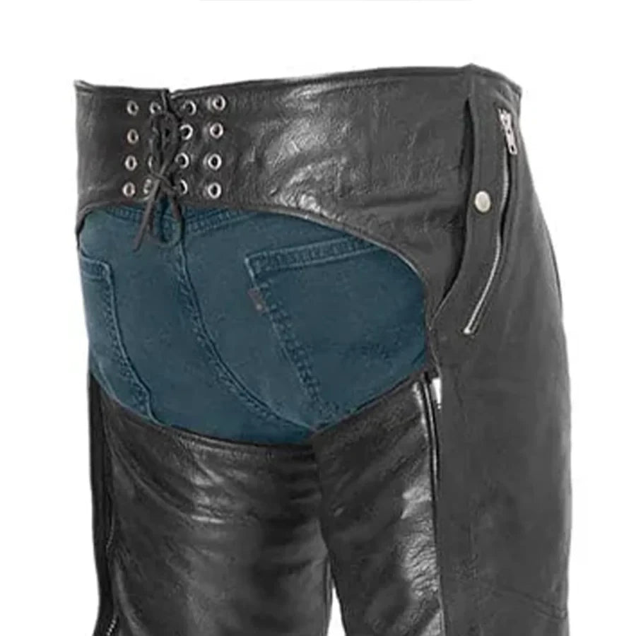Black leather and blue denim pants with grommet details on a white background