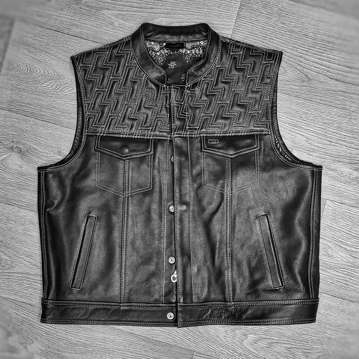 Black leather biker vest with geometric quilted shoulder panel and white stitching