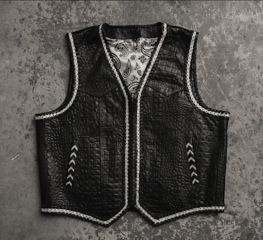 Men's black crocodile-embossed leather vest with white whipstitch trim and paisley lining