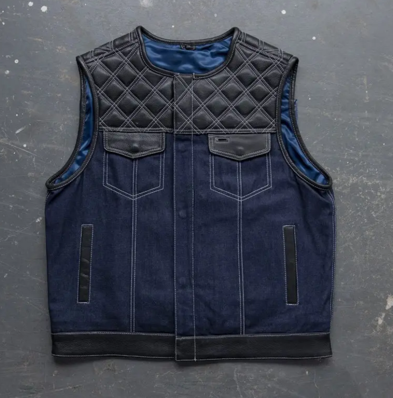 Men's navy denim motorcycle vest with quilted black leather yoke and trim
