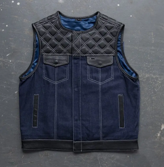 Men's navy denim motorcycle vest with quilted black leather yoke and trim