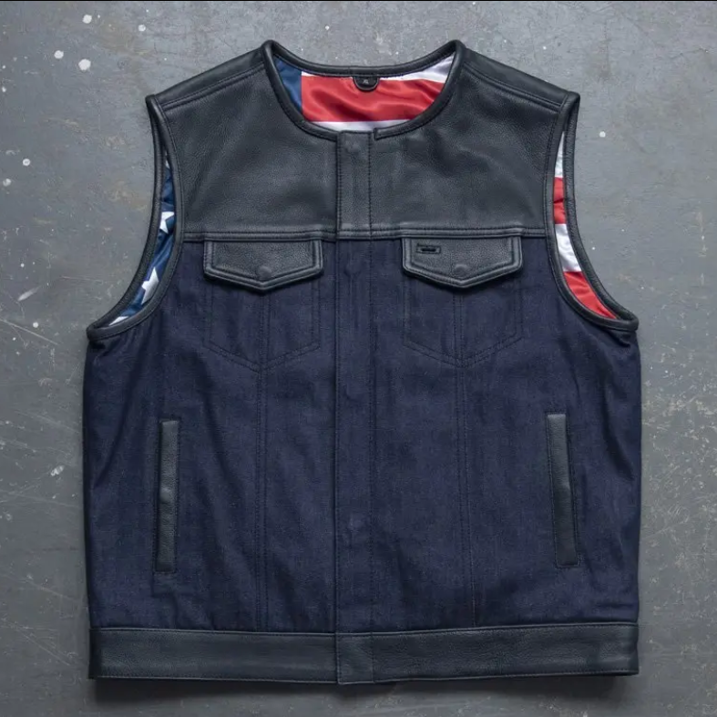 Men's navy denim motorcycle vest with black leather yoke and American flag lining