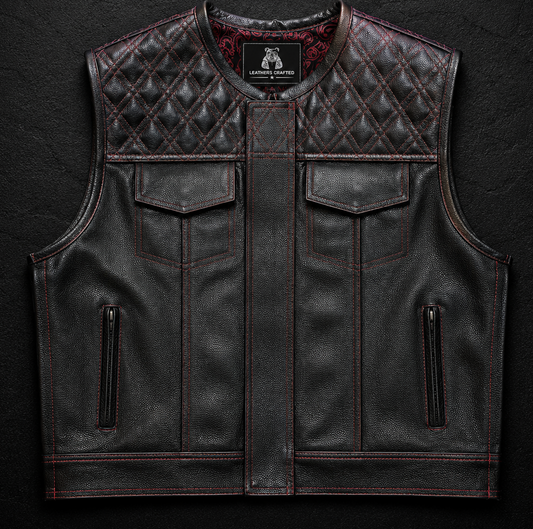 A black leather motorcycle vest with diamond-quilted shoulder panels and dark red contrast stitching, displayed against a dark textured background with the 'Leathers Crafted' logo above.