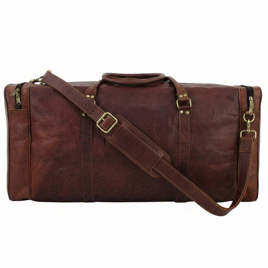 A large brown leather duffel bag with double top handles, brass-tone hardware, and zippered side pockets, shown against a plain white background.