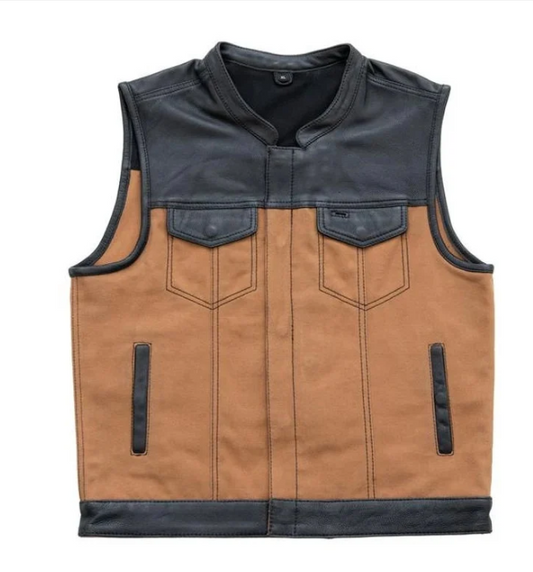 A men's motorcycle vest with a tan suede-like body and black faux-leather shoulders, collar, and trim, featuring two chest pockets and two vertical zippered hand pockets.